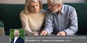 A couple looking concerned about a late fee from their HOA